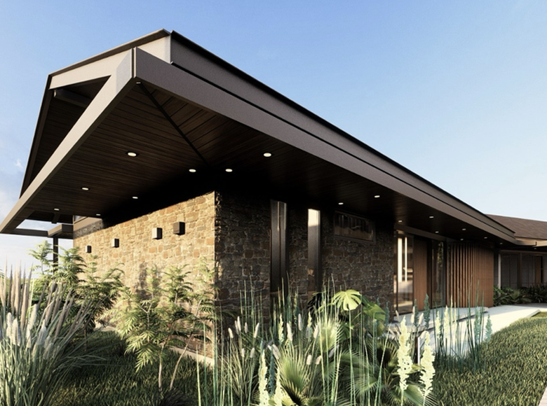Cantilevered roof over stone walls at dusk