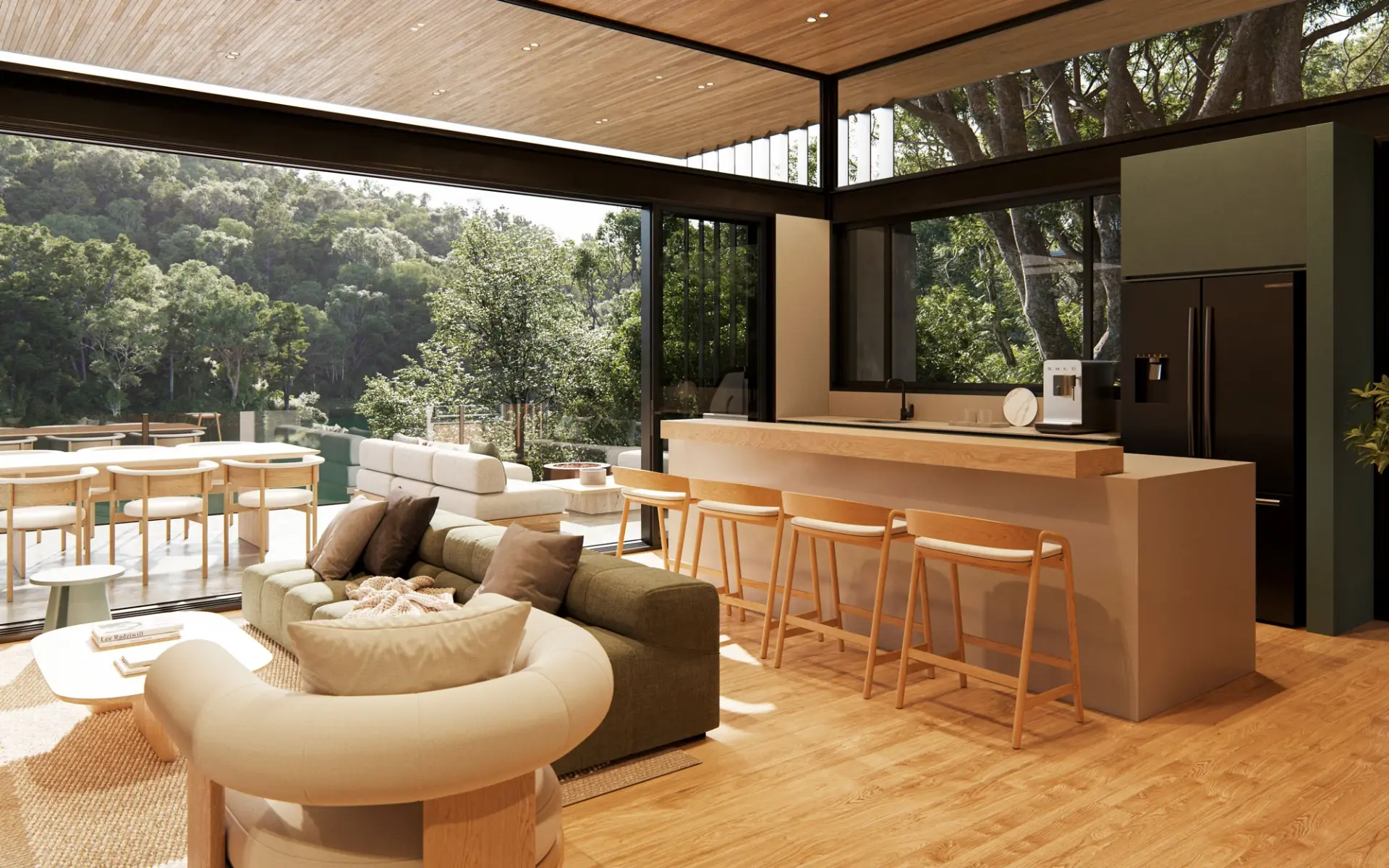 Open living, dining and kitchen area with forest views